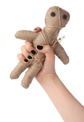 Woman holding voodoo doll with pins on white background, closeup