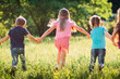 © davit85 - Large group of kids, friends boys and girls running in the park on sunny summer day in casual clothes .