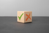 Fototapeta Mapy - pros and cons concept. wooden cube with a green check mark and a red cross. Concept of positive or negative decision making or choice of approval or rejection. Tick mark and cross mark on wooden cubes