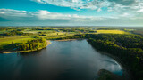 Fototapeta Las - Aerial view of blue lakes and green forests on a sunny summer day in Poland. drone photography