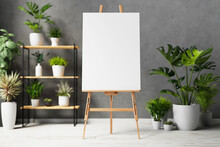 Blank Canvas On Wooden Easel With Plant