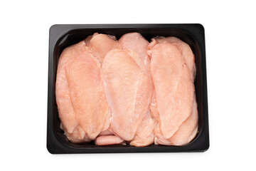 Wall Mural - Raw chicken fillet cut into thin slices in a black tray for a supermarket on a white background. Raw thin slices of chicken fillet Sottilissime.