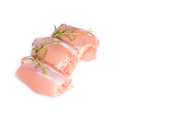 Wall Mural - Raw chicken thigh meat without bone and without skin with rosemary leaves on a white background isolade.