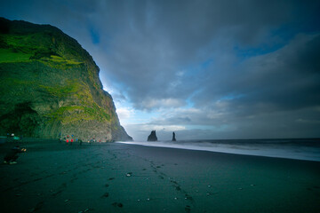 Wall Mural - The cliffs by the township of Vik in Iceland Reynisdrangar basalt sea stacks