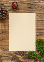 Christmas Composition with a blank card over wooden table flat lay