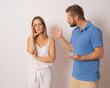 © Danko - Relationship Problem Concept. Portrait of young caucasian couple arguing on white background.