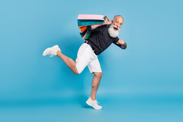 Sticker - Full length photo of pensioner old man hold bags run empty space sale isolated on pastel blue color background