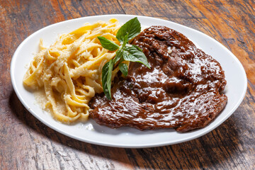 Sticker - Roasted steak with sauce and pasta