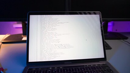 Wall Mural - computer code running over screen of laptop