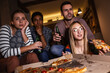 © BalanceFormCreative - Best friends sitting at home watching  movie .Joying in tv show and eating pizza.