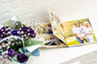 © Angelov - purple bouquet on the photobook on a light background