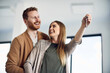 © Drazen - Close-up of happy couple with key of their new home.