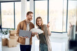 © Drazen - Young couple talk while making decisions for their home renovations.