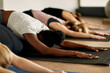 © Drazen - Group of female athletes stretch on exercise class at health club.