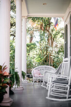 Luxurious Southern Front Porch With White Wicker Furniture