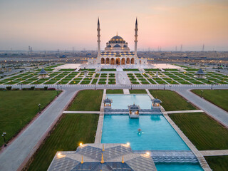 Wall Mural - The Sharjah Mosque in the Emirate of Sharjah, the United Arab Emirates aerial view