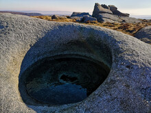 Beautiful Shot Of A Round Hollow Rock Formation Filled With Water