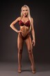 © Wisky - Athletic blond woman posing in lingerie in dark studio