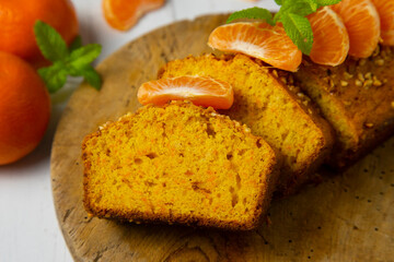 Wall Mural - Delicious vegan carrot and tangerine sponge cake with ground almonds.