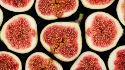 Wall Mural - Figs. Sliced fresh figs top view. Figs Isolated on black Background