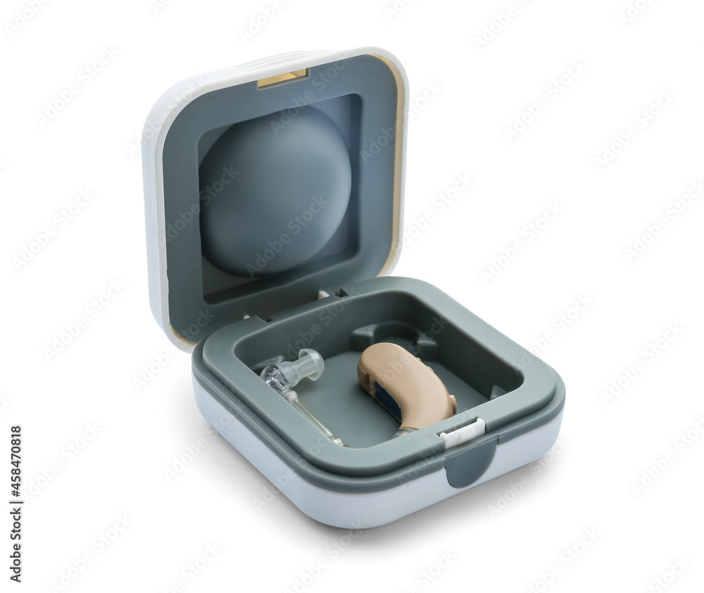 Box with hearing aid on white background