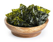 Wooden bowl with crispy nori seaweed korean snack isolated on white background. With clipping path.