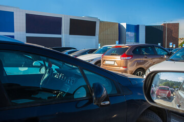 Poster - Cars in the parking lot at the shopping mall