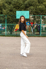 Wall Mural - Young beautiful brunette girl, autumn park outdoors