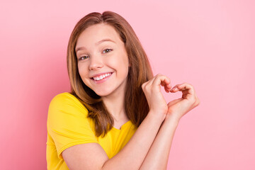 Poster - Photo of young cheerful girl happy positive smile show fingers heart love symbol isolated over pink color background