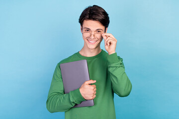 Poster - Photo portrait young guy keeping laptop wearing glasses smiling isolated pastel blue color background