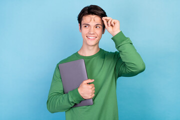 Wall Mural - Photo portrait young guy keeping laptop wearing glasses smiling looking copyspace isolated pastel blue color background