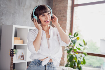 Sticker - Portrait of attractive cheerful girl listening different pop rock soul bass spending free time at home loft brick interior indoors