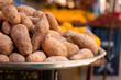 © Rabizo Anatolii - Sweet potatoes named batata on counter market on background of lemons.