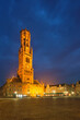 Belfry tower and Grote markt square in Bruges, Belgium on dusk in twilight