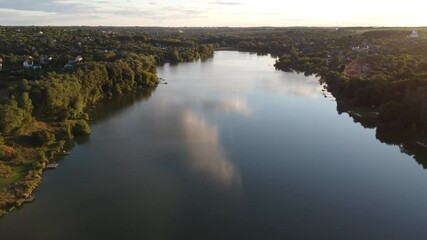 Wall Mural - View from a height of the lake with fishing piers at sunset