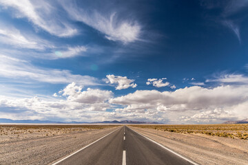 Centered road middle POV in a salt field. Salinas Grandes, Jujuy,  Northern Argentina. Symmetrical landscape photography.