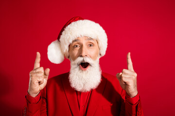 Sticker - Photo of shocked funky santa claus indicate forefingers up empty space open mouth wear x-mas hat suit on red color background