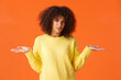 Waist-up shot upset and frustrated, clueless african american curly-haired girl, shrugging with hands spread sideways dismay, dont know, cant understand, feeling perplexed, orange background