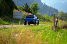 Cars Running On The Beautiful Road Along The Mountain, Rear View Of Pickup Truck On Wavy Road