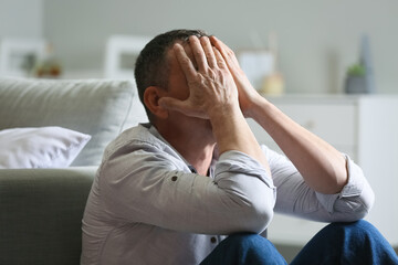 Sticker - Depressed mature man at home