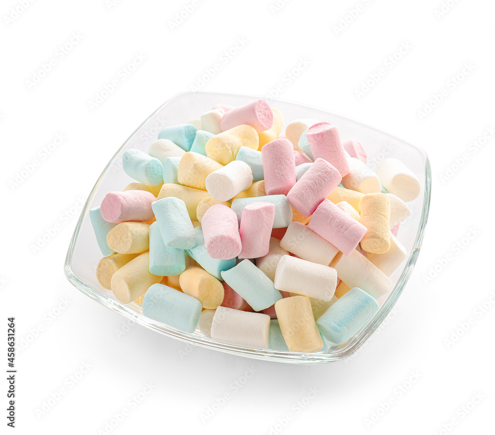 Glass bowl with sweet marshmallows on white background