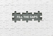 © MohamadFaizal - Top view of an empty space of jigsaw puzzle fill with a phrase Fill The Gaps.