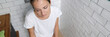 © H_Ko - Young woman is sitting on toilet with her eyes closed