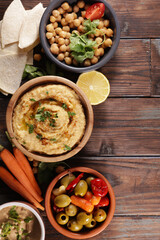 Wall Mural - bowl of hummus with pita bread and snack
