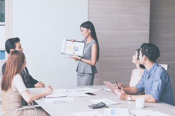 Wall Mural - Business woman and team having meeting at meeting room in office