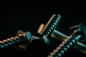 Sticker - Pile of screws on a black background