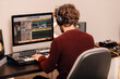 © carlesmiro - Male music producer working at home music studio