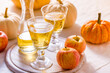 Apple cider with fresh apples and pumpkins for Thanksgiving