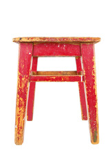 Wall Mural - Old wooden stool with peeling red paint. Loft style chair isolated on a white background.