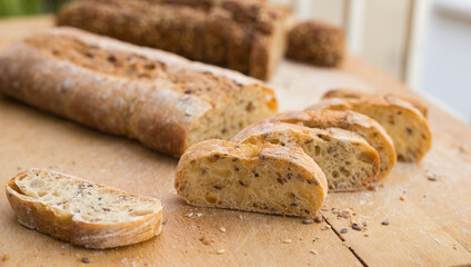 Wall Mural - fresh loaf of bread on wooden board